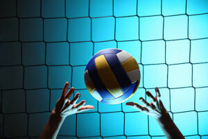 An image of a Player bouncing volleyball ball - TMG stock photo.