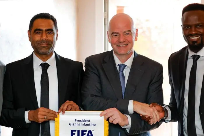 FIFA President Gianni Infantino (C), FKF President Hussein Mohammed (L), and FKF Vice President McDonald Mariga (R).